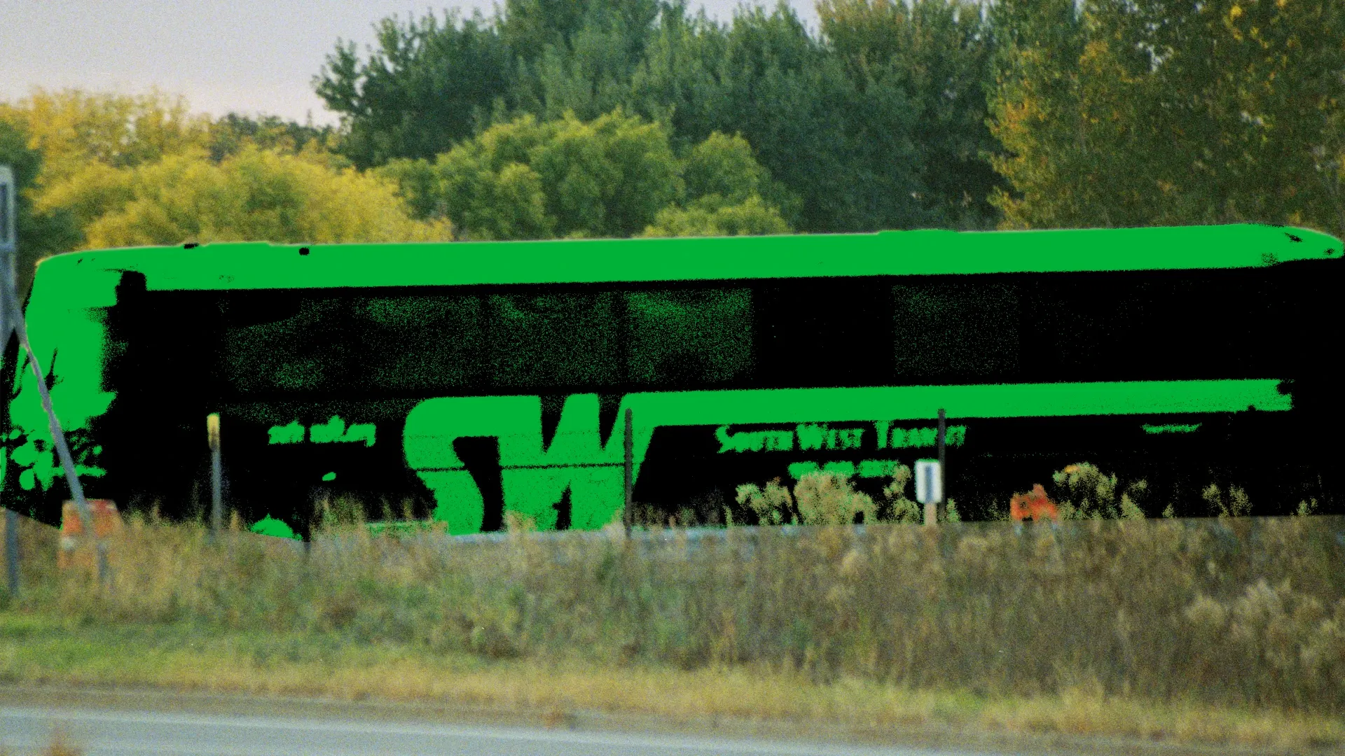A distorted image of a SouthWest Transit bus driving through Chanhassen.
